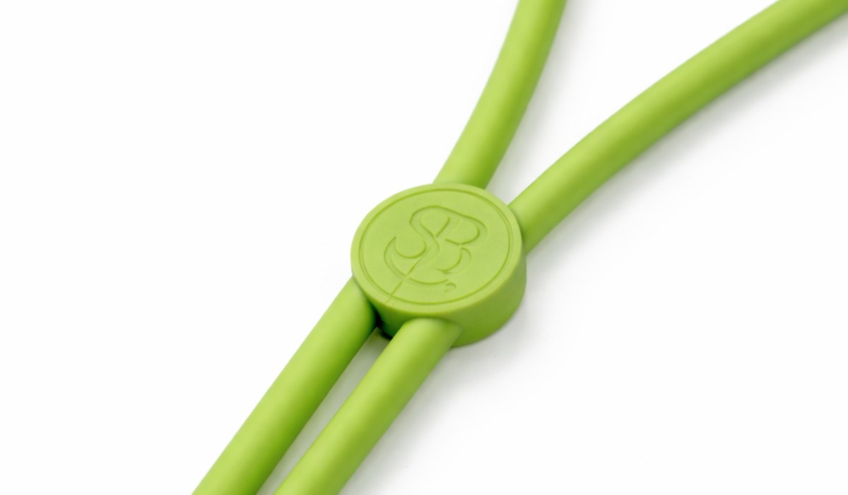 The clasp closed, forming a single round medallion with the complete S·B monogram